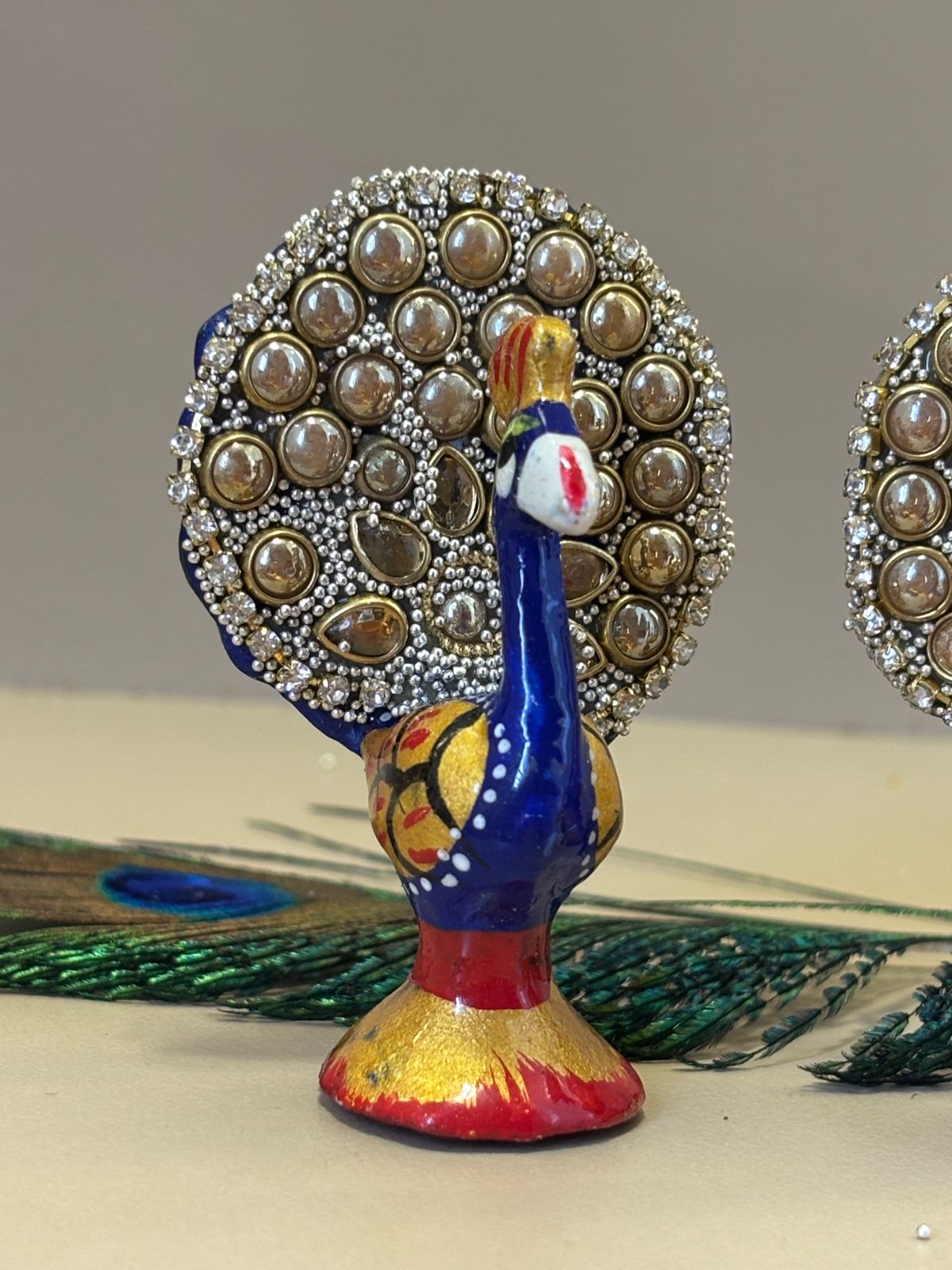 Kri-Radhey Kundan work metal peacock
